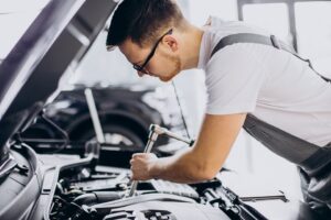 Repair man making car service